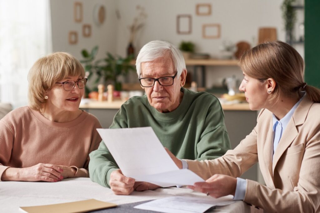 Senior couple discussing estate plans before travelling
